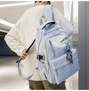 Sac à dos en toile bleu clair style collège pour étudiants, grand modèle pour l'école.