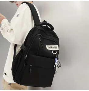 Sac à dos noir simple pour hommes et femmes, grand cartable de style collège pour étudiants.