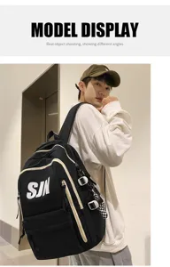 Detailed shot of a stylish black canvas backpack with white piping and SJN print, worn by model.