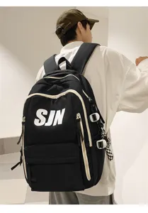 Stylish large capacity student backpack detail view, trendy black book bag with white letters.