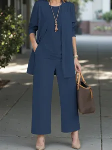 Stylish women's three-piece casual outfit with cardigan, top, and matching straight pants.