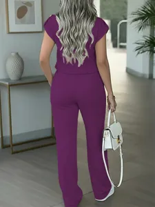 Back view of women solid purple casual short sleeve top and straight pants in modern room