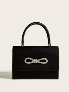 Elegante schwarze Abendtasche aus Satin mit funkelnder Strass-Schleife und Griff.