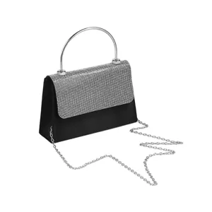 Nahaufnahme einer glitzernden Strass-Abendtasche mit silbernem Metall-Rundgriff und Kette.