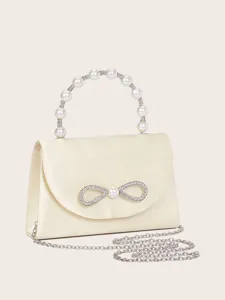 Detailansicht der Perlen-Griff Handtasche mit Strass-Schleife, elegante Satin-Abendtasche.