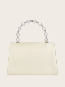 Elegante Abendtasche aus champagnerfarbenem Satin mit Perlen und Strass Griff Detailansicht.