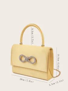 Elegante gelbe Satin-Abendtasche mit glitzerndem Strass-Schleife, Schulterkette und Henkel.