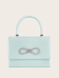 Elegante hellblaue Satin Abendhandtasche mit funkelnder Strass Schleife und Henkel.