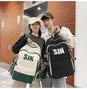 Detailed shot of trendy couple backpacks with color-block design and large capacity.