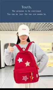 Cute red corduroy backpack for girls, sweet style school bag with star patches for daily use.