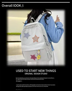 Detail view of the cute corduroy backpack featuring colorful star patches and straps.