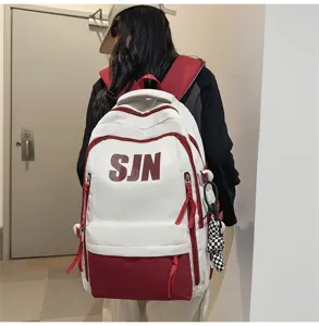 Trendy large capacity school backpack for students, stylish white and red design with multi compartments.