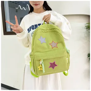 Cute Japanese style corduroy backpack for girls with star patches and pendants, casual daily use.