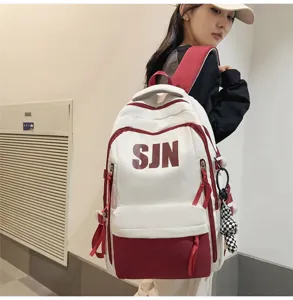 Casual canvas backpack with large capacity and stylish color block design for daily use.