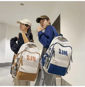 Stylish large capacity school backpack for teenagers, trendy contrast color casual daypack.