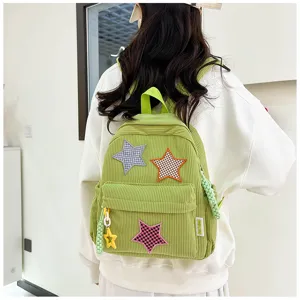 Cute green corduroy backpack with star patches, casual small school bag for daily fashion use.