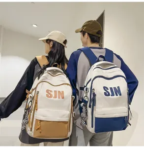 Casual large capacity backpack for students, stylish contrast color school bag for daily use.