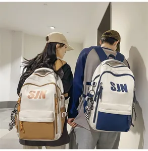 Close-up detail of the trendy large capacity student backpack with stylish color blocking.