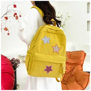 Cute Japanese style corduroy backpack for girls, soft school bag with star patches daily use.