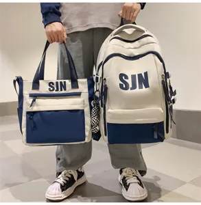 Trendy canvas school backpack and matching handbag set with large capacity for students.
