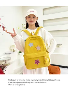 Small yellow corduroy backpack for women, cute star patchwork design for casual daily use.