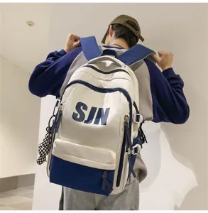 Detail shot of large capacity contrast color student backpack with stylish shoulder straps.