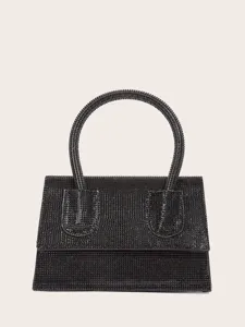 Schwarze Pailletten Abendhandtasche Detail, glitzernde Kristalloberfläche und eleganter Griff.