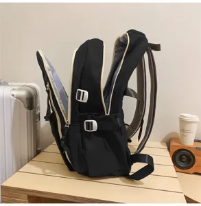 Black multi-compartment student backpack with side buckles and spacious storage design