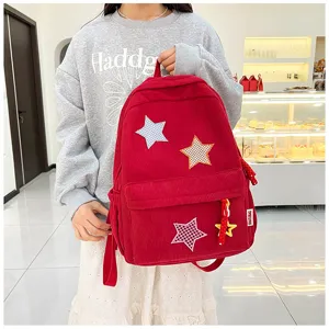 Red corduroy backpack for girls, cute Japanese ins style school bag with star patches.