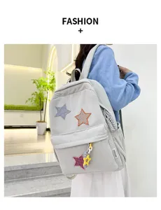 Cute corduroy backpack for teen girls, casual school bookbag with star patches and pendants.