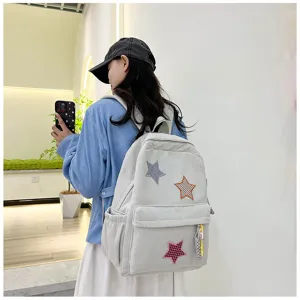 Corduroy backpack with star patches, cute casual school bag for daily wear and street fashion.