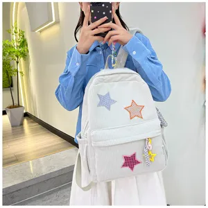 Japanese ins style soft cute girl small backpack with colorful star patches and pendants.