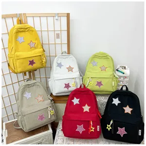 Corduroy small backpack with star patches, cute casual school bag for teen girls shopping.