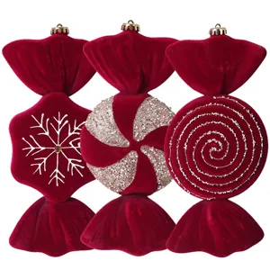 Red velvet Christmas candy ornaments set for holiday tree decoration and festive window display.