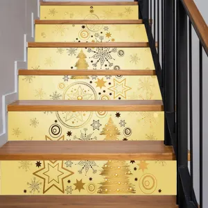 Detail view of Christmas stair sticker featuring gold tree and snowflake patterns on wooden steps.