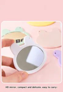 Detail view of the cute rabbit shaped makeup mirror, compact handheld portable design.