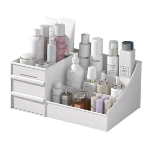 White desktop cosmetic storage box with drawers and multi-compartments for skincare organization.