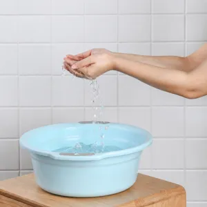 Large plastic washing basin for household laundry and dorm use. Durable, thick, and practical.