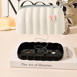 Creative tissue box with lifting spring and bow decor for living room table home decor styling.