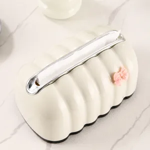 Cream ribbed tissue box with silver trim and pink bow for living room and car decor