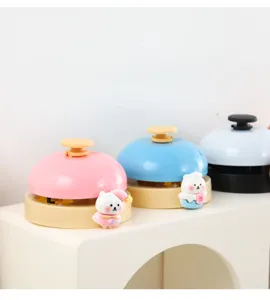 Cute cartoon character call bell for desktop service, restaurant, or pet training use.