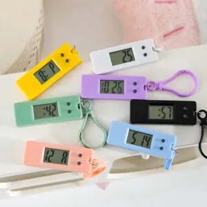Colorful mini electronic keychain clock for students, portable digital hanging watch display.