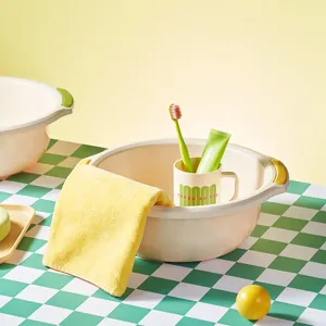 Plastic washbasin for dorm room use, portable daily laundry and face washing basin with yellow handles.