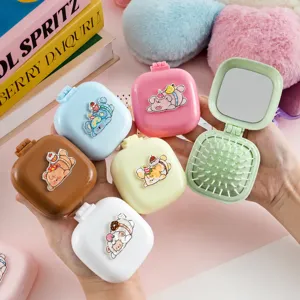 Brosse à cheveux de poche pliante portable avec miroir, design de dessin animé mignon.