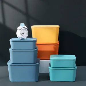 Plastic storage boxes with lids set for desktop, snacks, clothes, and toy organization.