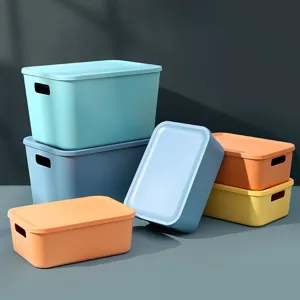 Plastic desktop storage box with lid for toys cosmetics and snacks sorting organization.