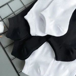 Men's breathable short boat socks detail shot, black and white cotton ankle socks close up.