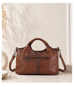 Detailed view of retro genuine leather tote bag, soft cowhide material, elegant woven handle detail.
