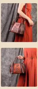 Handgemaakte vintage lederen tote tas detail, in reliëf bloemdesign met geweven accenten.
