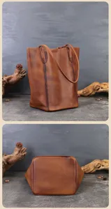 Dettaglio della tote in pelle marrone retro, borsa a secchiello capiente con texture.
